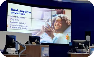 A video wall behind the tellers in a bank branch