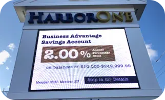 An outdoor digital sign at a HarborOne Bank branch