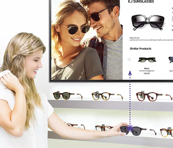girl looking at glasses with digital signage lift and learn