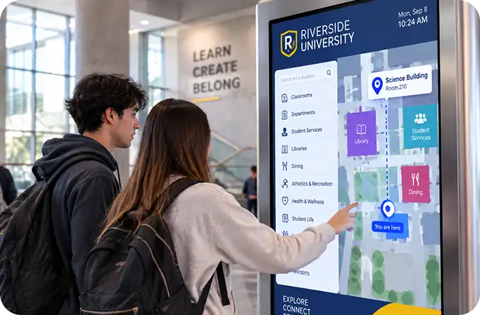 Students using a campus kiosk to route to the science building